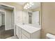Bathroom features quartz countertop, modern lighting, and ample cabinet space at 392 Summer Squall Rd, Davenport, FL 33837