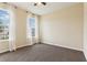 Bright bedroom with carpet, large window, and natural light at 392 Summer Squall Rd, Davenport, FL 33837