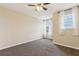 Bedroom with natural light, ceiling fan, and neutral carpet at 392 Summer Squall Rd, Davenport, FL 33837