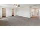 Bonus room with neutral paint, ceiling fan and two closets at 392 Summer Squall Rd, Davenport, FL 33837