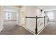 Hallway with white wood banister, view to bedroom and bathroom at 392 Summer Squall Rd, Davenport, FL 33837