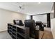 Comfortable home theater with plush seating, projector, and screen, perfect for entertaining or Gathering movie nights at 392 Summer Squall Rd, Davenport, FL 33837