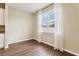 Bright living room with wood floors, large window, and natural light at 392 Summer Squall Rd, Davenport, FL 33837