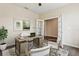 Comfortable home office with modern furniture, a ceiling fan, and bright lighting at 392 Summer Squall Rd, Davenport, FL 33837
