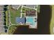 Aerial view of a community pool, clubhouse, and playground surrounded by lush greenery and a lake at 747 Honeyrock St, Debary, FL 32713