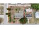 Aerial view of property highlighting lot size, landscaping, roof, and neighborhood at 1002 Ne 1St St, Mulberry, FL 33860