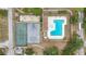 Aerial view highlighting community amenities including a pool, tennis courts, and a skate park at 1002 Ne 1St St, Mulberry, FL 33860
