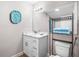 Bathroom with white vanity, stylish mirror, and coordinated decor at 1002 Ne 1St St, Mulberry, FL 33860