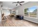 Open-concept living area with sleek flooring, natural light, and neutral paint at 1002 Ne 1St St, Mulberry, FL 33860