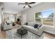 Bright living room with plush seating and large windows at 1002 Ne 1St St, Mulberry, FL 33860