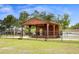 A wooden outdoor stage offers a venue for community events and entertainment at 1002 Ne 1St St, Mulberry, FL 33860