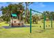 A charming playground featuring a pirate ship play structure and swings for children to enjoy at 1002 Ne 1St St, Mulberry, FL 33860