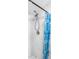 Updated shower with decorative blue curtain featuring a dual shower head and sleek tile surround at 1002 Ne 1St St, Mulberry, FL 33860