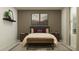 Inviting bedroom with soft lighting, tasteful decor, and a comfortable upholstered bench at 1109 Hour Glass Rd, Lakeland, FL 33801