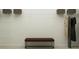Spacious walk-in closet with shelving, hanging space, and a comfortable bench, offering ample storage for clothes and accessories at 1109 Hour Glass Rd, Lakeland, FL 33801