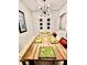 Large rustic dining table with decorative lighting and modern decor at 13140 Summerton Dr, Orlando, FL 32824