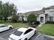 Well maintained townhouse featuring manicured landscaping and reserved parking at 13140 Summerton Dr, Orlando, FL 32824