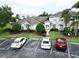 A townhouse with manicured landscaping and reserved parking spaces at 13140 Summerton Dr, Orlando, FL 32824