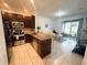 Modern kitchen featuring stainless steel appliances and an open floor plan at 13140 Summerton Dr, Orlando, FL 32824