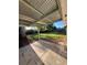 Spacious backyard with a covered patio, perfect for outdoor relaxation and entertaining at 5532 Stull Ave, Orlando, FL 32810