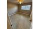 Neutral bedroom featuring a ceiling fan and a large window at 5532 Stull Ave, Orlando, FL 32810