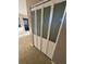 Hallway closet with ornate folding doors at 5532 Stull Ave, Orlando, FL 32810