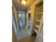 Neutral hallway featuring multiple doors and a linen closet at 5532 Stull Ave, Orlando, FL 32810