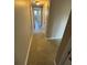 Neutral hallway featuring multiple doors and neutral walls at 5532 Stull Ave, Orlando, FL 32810