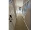Bright hallway with closet and natural light, showcasing the home's layout at 5532 Stull Ave, Orlando, FL 32810