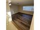 Cozy living room with wood-look flooring and a bright window at 5532 Stull Ave, Orlando, FL 32810