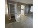 Open living room with lots of storage and a view into the kitchen at 5532 Stull Ave, Orlando, FL 32810