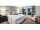 Comfortable bedroom features neutral decor, carpeted floor, and windows with views to outside at 1038 Foreshore Ln, Haines City, FL 33844