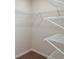 Walk-in closet with ample shelving provides efficient storage space for an organized wardrobe at 3775 King Hill Dr, Haines City, FL 33844
