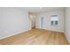 Spacious living room with light wood flooring, a patio door, and neutral walls at 3775 King Hill Dr, Haines City, FL 33844