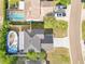 Birds eye view of a single-Gathering house with an above ground pool and driveway at 728 Waterbridge Dr, Winter Haven, FL 33880