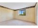 Cozy bedroom with plush carpet and a large window at 728 Waterbridge Dr, Winter Haven, FL 33880