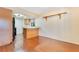 Dining area with hardwood floors, a breakfast bar, and an adjacent kitchen offering an open and inviting space at 728 Waterbridge Dr, Winter Haven, FL 33880