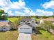 Two-story home with a white exterior, dark shingle roof and attached garage at 728 Waterbridge Dr, Winter Haven, FL 33880