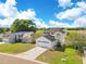 Two-story home with a white exterior, dark shingle roof and attached garage at 728 Waterbridge Dr, Winter Haven, FL 33880