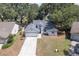 Inviting home with a two-car garage, well-manicured lawn, and mature trees enhancing curb appeal at 748 Sagewood Dr, Lakeland, FL 33813