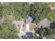 Aerial view of a single-Gathering home with mature trees at 748 Sagewood Dr, Lakeland, FL 33813