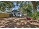 Large backyard features mature trees and a wooden fence at 748 Sagewood Dr, Lakeland, FL 33813