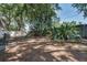 Large backyard features mature trees, a playground, and a wooden fence at 748 Sagewood Dr, Lakeland, FL 33813