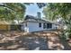 The backyard has a screened patio, a grill, wood fence, and an AC unit at 748 Sagewood Dr, Lakeland, FL 33813