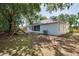 Wide backyard with a playset, a screened patio, a grill, and ample space at 748 Sagewood Dr, Lakeland, FL 33813