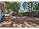 Large backyard features mature trees and a wooden fence at 748 Sagewood Dr, Lakeland, FL 33813