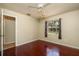 Bedroom with hardwood floors, ceiling fan, neutral walls and a sunlit window at 748 Sagewood Dr, Lakeland, FL 33813