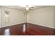 Bedroom featuring wood floors, neutral walls, windows, and a ceiling fan at 748 Sagewood Dr, Lakeland, FL 33813