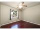 Bedroom featuring wood floors, neutral walls, and a ceiling fan at 748 Sagewood Dr, Lakeland, FL 33813