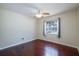 Bedroom featuring wood floors, neutral walls, and a ceiling fan at 748 Sagewood Dr, Lakeland, FL 33813